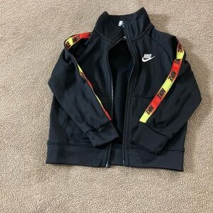 Nike Kids Black Jacket with Red-Yellow Stripe Detail